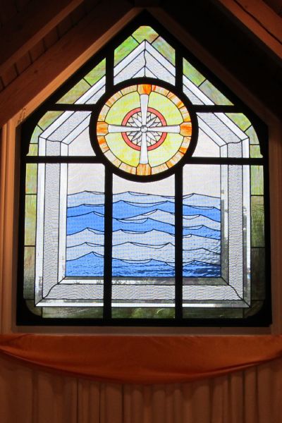 stained glass window on the west side of the church